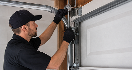 Garage Door Cable Repair Technician in Black Uniform