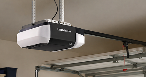 Garage door opener installed on residential garage ceiling