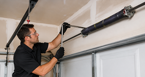 Garage Door Spring Installation Technician in Black Uniform